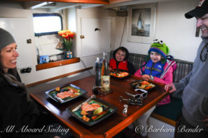 Enjoying barbecued supper in the galley