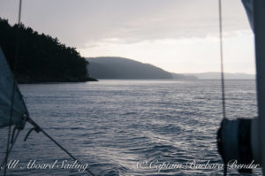 Sailing to clear Point Caution, San Juan Island