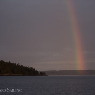 Sunset sail with rainbows